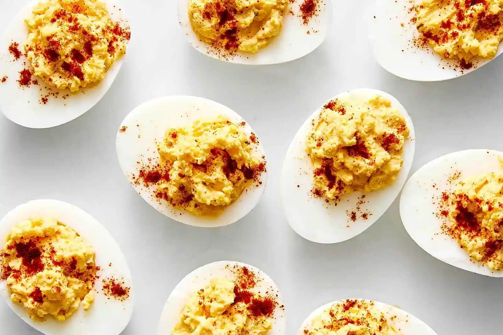 Classic Deviled Eggs Recipe: The Ultimate Guide to Perfect, Creamy Deviled Eggs 2 A platter of classic deviled eggs sprinkled with paprika and fresh chives